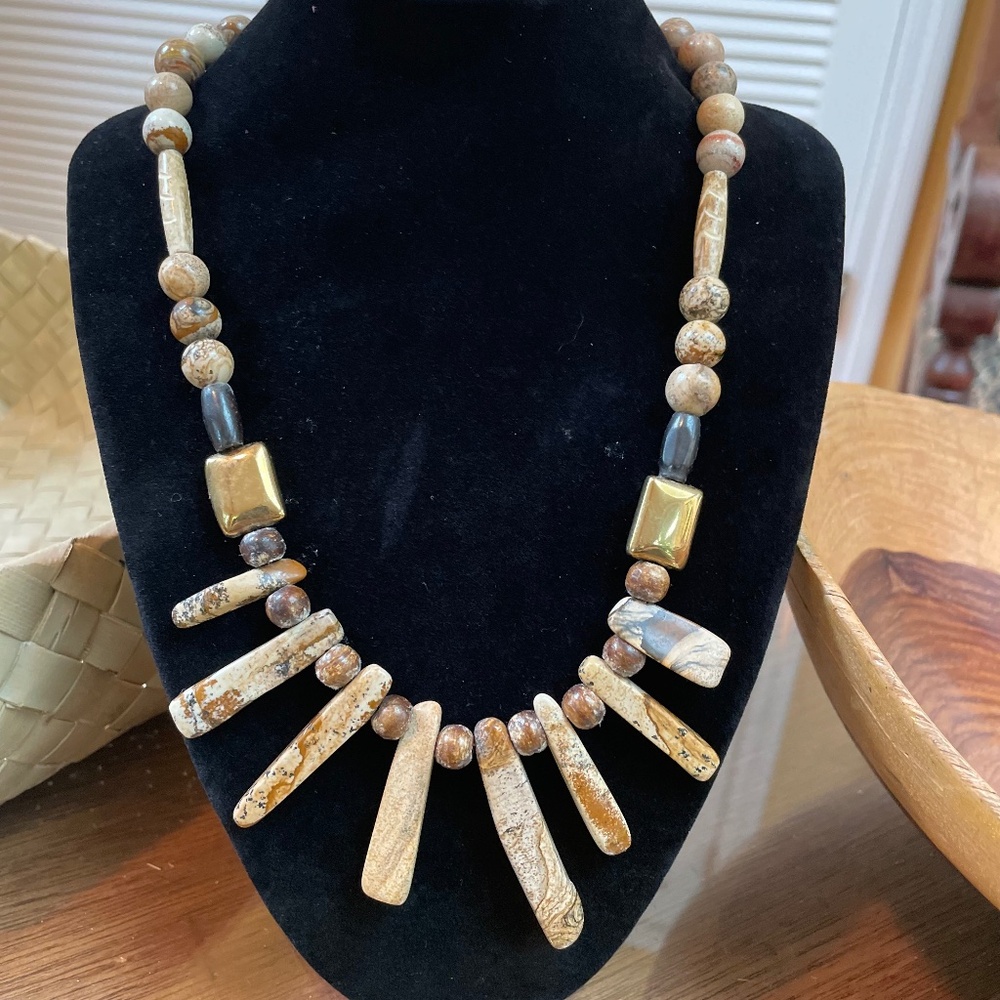 Beautiful picture jasper necklace with rectangular gold colored metal beads.